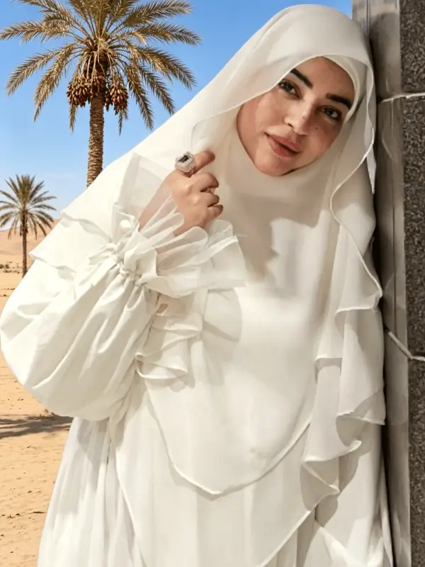 فستان زفاف طويل الأكمام من الدانتيل بأسلوب رومانسي رجعي، ظهر مكشوف برباط متقاطع وتنورة من التول المتفتح